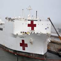 USNS Comfort (T-AH 20) takes on fuel and supplies at Naval Station Norfolk, Va. in preparation to deploy to New York in support of the nation’s COVID-19 response efforts and will serve as a referral hospital for non-COVID-19 patients currently admitted to shore-based hospitals. (U.S. Navy photo by Jim Kohler)