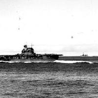 USS Enterprise (CV-6) steaming at high speed at about 0725 hrs, June4,  1942, seen from USS Pensacola (CA-24). The carrier has launched Scouting Squadron Six (VS-6) and Bombing Squadron Six (VB-6) and is striking unlaunched SBD aircraft below in preparation for respotting the flight deck with torpedo planes and escorting fighters. (Official U.S. Navy Photograph, U.S. National Archives.)