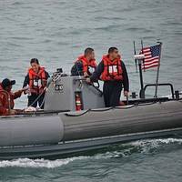 USS Spruance rescuers & survivor: USN Photo