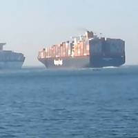 Video screenshot via PoliceInPortsaid of Colombo Express (right) about to collide with Maersk Tanjong in the Suez Canal