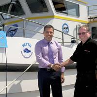 Wildcat Marine Co-Owner Dr Omar Namor (left) Receives Their Blyth 17 From Ray Chuter, Blyth Workcats' Production Director