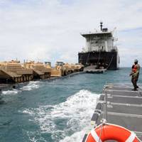  Military Sealift Command Maritime Prepositioning Ship USNS 1st Lt. Baldomero Lopez conducts an at-sea offload of Marine Corps cargo off the coast of Thailand May 2. The operation, which began April 28 and ended May 8, delivered cargo for the 3rd Marine Expeditionary Force, which will participate in Cobra Gold – an annual exercise designed to promote regional stability and security throughout Southeast Asia. A second MSC Maritime Prepositioning ship, USNS 1st Lt. Harry L. Martin, also participat