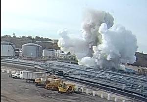 This screen shot from video captured by a camera at the nearby Illinois and Michigan Oil Company facility, shows the November 4, 2019, explosion of barge IB1940 at the Illinois Marine Towing Heritage Slip near Lemont, Ill. (Image courtesy of Illinois and Michigan Oil Company / NTSB)