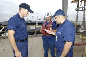 File photo: U.S. Coast Guard officers perform a TWIC card check. (Photo: Renee C. Aiello / U.S. Coast Guard)