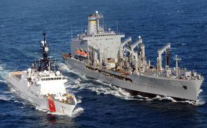 A patrol boat manned by members of Port Security Unit 311 deployed to Joint Task Force-Guantanamo Bay, Cuba, escorts the Coast Guard Cutter Bertholf as it sails into Naval Base Guantanamo Bay.  The Coast Guard Cutter Waesche conducts at-sea refueling operations.  The Alameda-based cutter is named in honor of former Coast Guard Commandant Adm. Russell Waesche.  (U.S. Coast Guard photo by Petty Officer 1st Class Matthew Roache)