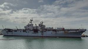 The fire-stricken amphibious assault ship USS Bonhomme Richard (LHD 6) sits pier side at Naval Base San Diego in July 2020. (Photo: Jason Waite / U.S. Navy)