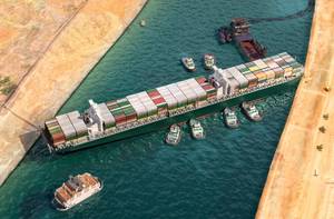 Illustration of the Ever Given blocking the Suez Canal - Credit: Corona Borealis/AdobeStock