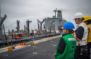 A US Navy oiler underway and engaged in unrep operations. (CREDIT: Nicholas Burgaines)