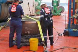 Coast Guard marine safety engineers assigned to the Marine Safety Center, working for the Marine Board of Investigation for the Titan submersible case, conduct a survey of the aft titanium endcap from Titan in the North Atlantic Ocean October 1, 2023. The endcap was recently recovered from the seafloor and successfully transferred to a U.S. port for analysis. (Photo: U.S. National Transportation Safety Board)