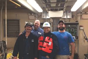 Ed Grimm, (second from left) CEO, Southern Towing Company during a crew visit.