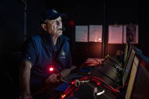 In 2019, Nautilus plied the Pacific waters off the island of Nikumaroro, searching for any sign of Amelia Earhart's lost plane. In the cool, dark control room, we kept a 24-hour vigil. (Gabriel Scarlett/National Geographic Image Collection)