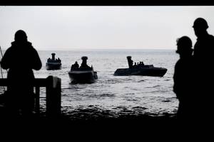 Naval Special Warfare Combatant Craft Assault boats approach the well deck of the San Antonio-class amphibious transport dock ship USS Somerset (LPD 25).
U.S. Navy photo by Mass Communication Specialist 2nd Class Evan Diaz