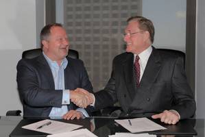 Shane J. Guidry, Chairman & CEO, Harvey Gulf (left) and J. Barry Snyder, President, Signet Maritime sign closing documents on May 15 at Harvey Gulf International Marine in New Orleans, Louisiana for the sale of Harvey’s Offshore Towing Division to Signet Maritime.