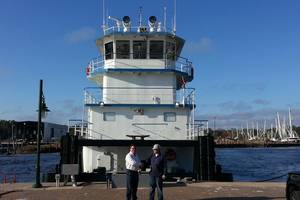 Travis R. Short of Horizon Shipbuilding with Jeff Brumfield of FMT in front of newbuild M/V Michael Akiu #86  (Photo: Horizon Shipbuilding)
