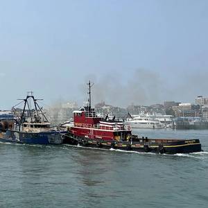 Tug Crew Tows Fire-stricken and Abandoned Trawler to Portland, Maine