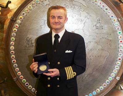 2014 IMO Award for Exceptional Bravery at Sea: Captain Andreas Kristensen with the medal he and his crew of the Britannia Seaways received. (Photo: IMO)