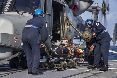 208 Flight load a TVT (dummy) onto a Wildcat HMA Mk2 (Photo: Royal Navy)