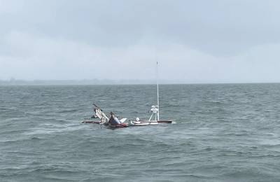 A 38-foot deadrise fishing vessel, the Miss Heather, sinks after colliding with a pilot boat near the Newport News Small Boat Harbor, in the James River, Virginia, on May 30, 2023. The pilot aboard the Swift rescued the two fishermen from the Miss Heather and brought them aboard the pilot boat as the fishing vessel rapidly took on water. (Photo: U.S. Coast. Guard)