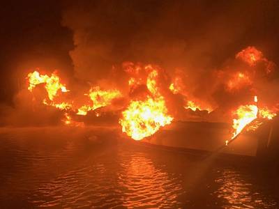 A 36-foot fishing vessel ablaze near Dauphin Island, Ala. (U.S. Coast Guard photo)