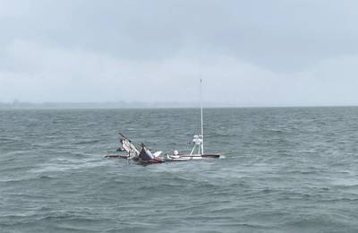 A 38-foot deadrise fishing vessel, the Miss Heather, sinks after colliding with a pilot boat near the Newport News Small Boat Harbor, in the James River, Virginia, on May 30, 2023. The pilot aboard the Swift rescued the two fishermen from the Miss Heather and brought them aboard the pilot boat as the fishing vessel rapidly took on water. (Photo: U.S. Coast. Guard)