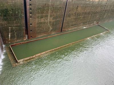 A barge carrying gravel sank June 11, 2022, in the chamber of Kentucky Lock in Grand Rivers, Ky. The Corps of Engineers Nashville District is working with Terral River Service to refloat the barge June 14. (Photo: Caleb Skinner / USACE)