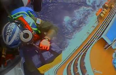 A Coast Guard Air Station New Orleans MH-60 Jayhawk helicopter medevacs a patient from a cruise ship, approximately 300 miles offshore from Fort Morgan, Alabama, April 29, 2023. (Source:  U.S. Coast Guard video by Coast Guard Air Station New Orleans)