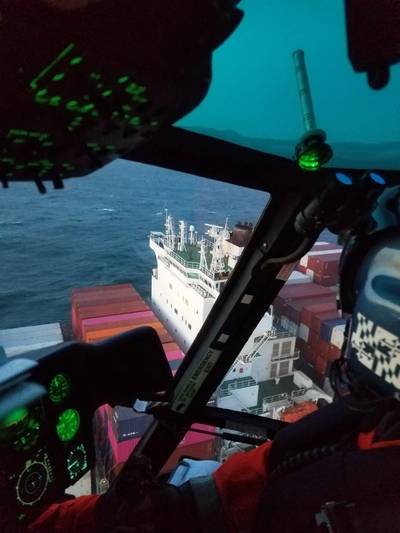 A Coast Guard helicopter crew approaches the Yang Ming Unanimity containership to conduct a medevac near the San Francisco Bay in San Francisco, Calif., April 4, 2020. (U.S. Coast Guard courtesy photo) 