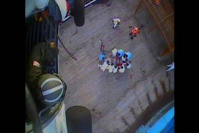 A Coast Guard helicopter crew hoists a 77-year-old woman suffering stroke symptoms, Monday, July 6. The crew took the ailing passenger to Vidant Medical Center in Greenville, North Carolina. (Screenshot from U.S. Coast Guard video by Air Station Elizabeth City)