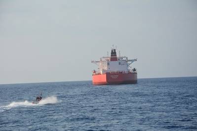 A Coast Guard small boat crew approaches the 820-foot motor tanker, Philotimos, approximately 155 miles southwest of Key West, Thursday. (U.S. Coast Guard Photo) 