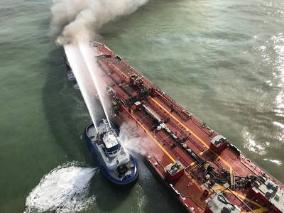 A Corpus Christi Fire Department vessel extinguishes a fire on board Buster Bouchard/B. No. 255 approximately three miles from the Port Aransas, Texas, jetties on October 20, 2017. (Photo: U.S. Coast Guard)