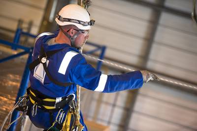 A Dron & Dickson rope access technician working at height.