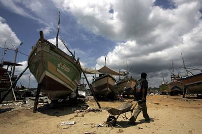 A fishing trawler damaged by the December 2004 tsunami under repairs at the Kudewella boat repair centre in Sri Lanka with assistance from FAO. Photo: FAO/Prakash Singh