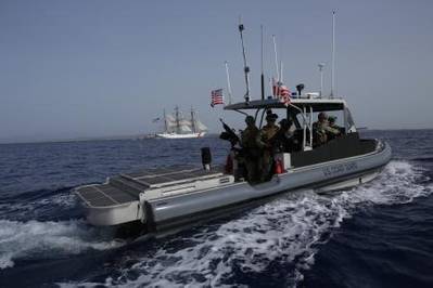 A patrol boat manned by members of Port Security Unit 311 deployed to Joint Task Force-Guantanamo Bay, Cuba, escorts the Coast Guard Cutter Eagle as it sails into Naval Base Guantanamo Bay, June 7, 2013. (U.S. Coast Guard photo by Petty Officer 2nd Class Steven Bolz)