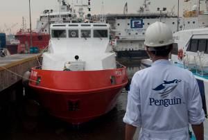 A Penguin staffer looks over the recently delivered Pelican Grand. Photos by Haig-Brown courtesy of Cummins Marine.