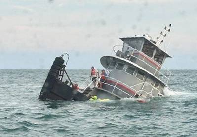 A rescue swimmer assists crewmembers into the water during the Jacqueline A sinking. (Photo: North Myrtle Beach Rescue Squad)