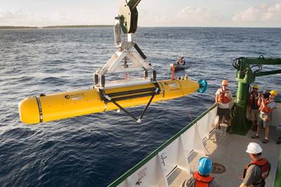 The team aboard the K-O-K research vessel prepare the Bluefin Robotics AUV for deployment. The vehicle was equipped with a Ranger 2 tracking transponder, visible towards the rear of the AUV