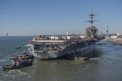 About 500 shipbuilders assisted with the undocking of the aircraft carrier USS Abraham Lincoln (CVN 72) on Monday. Lincoln was moved from a dry dock to an outfitting berth at Newport News Shipbuilding, where its refueling and complex overhaul will be completed. Photo by Ricky Thompson/HII