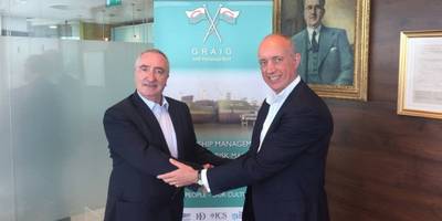 Alasdair Evitt, Group Director, Ship Management East, V.Group shakes hands with Hugh Williams, Chief Executive Officer, Graig Shipping Plc following announcement to employees in Cardiff and Shanghai (Photo: V.Group)