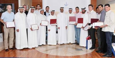 Amer Ali, Executive Director, Dubai Maritime City Authority, among marine driver’s license holders with senior officials in DMCA during the ceremony at DMCA headquarters.