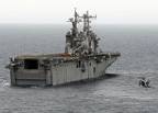 An MH-60 Seahawk helicopter approaches the amphibious assault ship USS Nassau (LHA 4). Nassau is one of six vessels in the Nassau Strike Group deployed in the U.S. 5th Fleet area of operations supporting Maritime Security Operations. U.S. Navy photo by Mass Communication Specialist 3rd Class Coleman Thompson