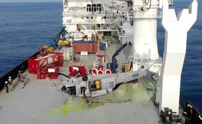 An MH-60S on deck of contracted salvage vessel off the coast of Yokosuka, Japan on March 18, 2021, having just been pulled from the depth of 19,075 ft by NAVSEA Supervisor of Salvage and Diving, (SUPSALV) at the request of the Navy Safety Center to facilitate accident investigation. This depth, a SUPSALV record, achieved using the ROV CURV 21 (painted yellow in background), deep ocean lift line and heave compensated Fly Away Dive System (red equipment behind helicopter). (Photo: U.S. Navy)