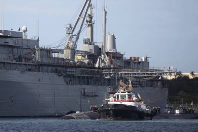 The Los Angeles-class fast-attack submarine, USS Columbia (SSN 771) moors alongside the submarine tender USS Emory S. Land (AS 39) in Apra Harbor, Naval Base Guam, Jan. 4.  (U.S. Navy photo by Mass Communication Specialist 1st Class Joshua M. Tolbert)