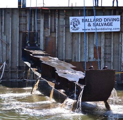 Another section of the vessel rises from the water