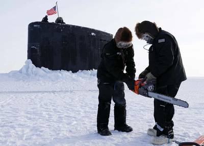 The Arctic region has become an area of intense geopolitical interest and competition. Field technicians assigned to the Arctic Submarine Laboratory prepare to remove ice from the Los Angeles-class attack submarine USS Hampton (SSN 767) at Ice Camp Whale on the Arctic Ocean, during Operation Ice Camp (ICE CAMP) 2024. ICE CAMP is a three-week operation that allows the Navy to assess its operational readiness in the Arctic, increase experience in the region, advance understanding of the Arctic env