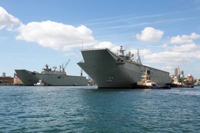 Australia’s second Landing Helicopter Dock (LHD) ship, HMAS Adelaide, arriving at its new home at Fleet Base East Garden Island, Sydney. (Photo courtesy of the RAN)
