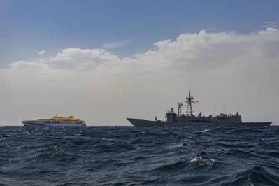 Bajamar Expess trimaran being escorted by the Spanish frigate ESPS Santa Maria