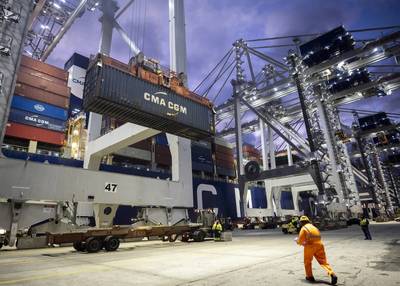 Members of the International Longshoremen’s Association and the newly formed stevedoring operation Gateway Terminals handle their first container together, Monday, Jan. 3, 2022, at Garden City Terminal in Savannah, Ga. (GPA Photo / Stephen B. Morton)