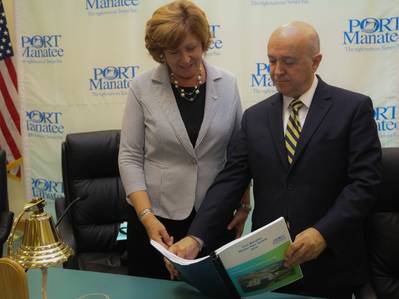 Betsy Benac, chairwoman of the Manatee County Port Authority, left, looks over the 2016 Port Manatee Master Plan Update with Carlos Buqueras, the port’s executive director. (Photo: Port Manatee)