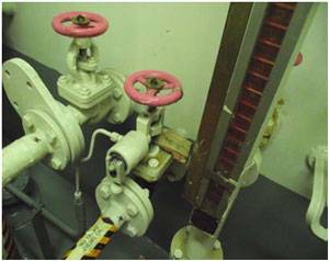 QCV blocked utilizing a wooden block to hold the valve in the open position. Photos are courtesy of U.S. Coast Guard Sector New Orleans