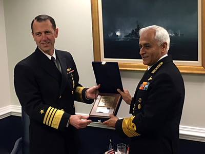 Chief of Naval Operations (CNO) Adm. John Richardson presents a plaque to Indian Navy chief Adm. Sunil Lanba at the Pentagon. (U.S. Navy photo by Nathan Laird)